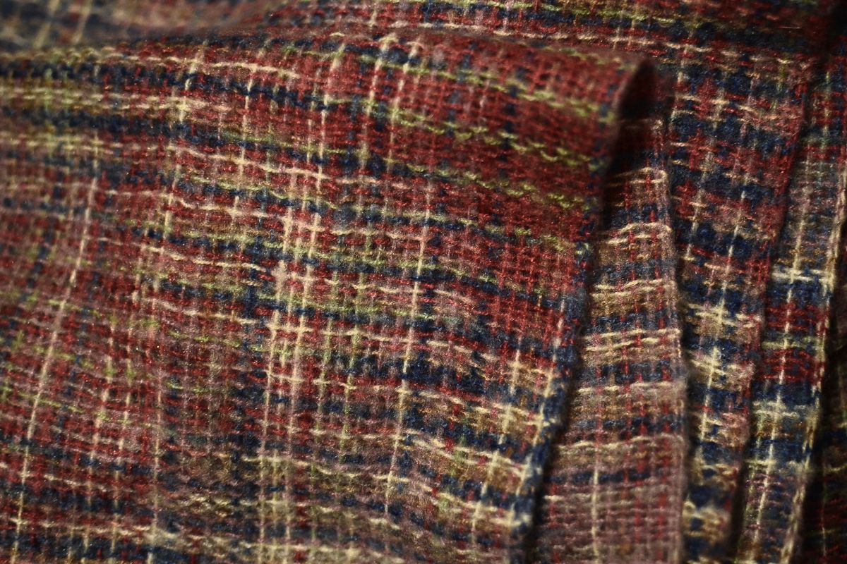 A tape measure laid across a fabric swatch