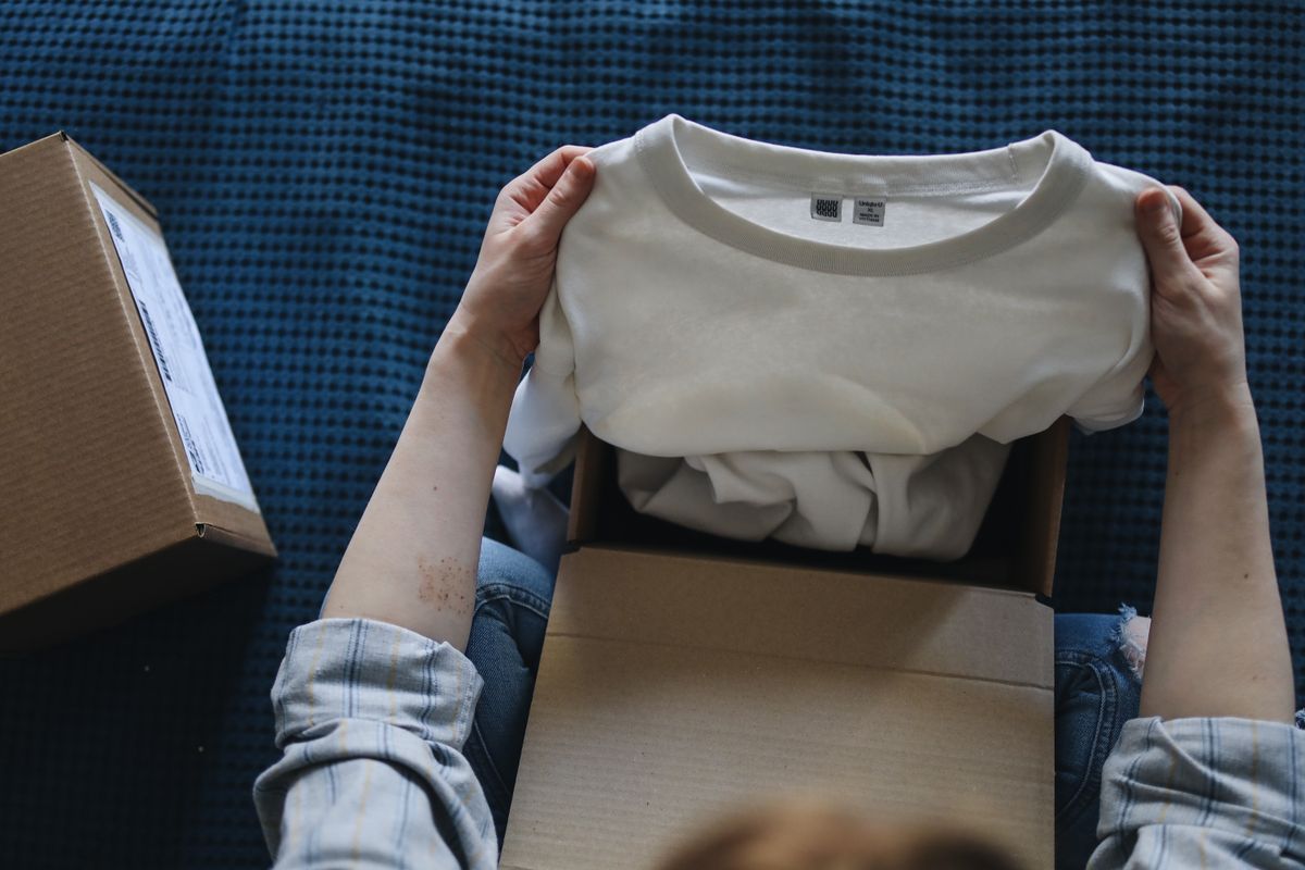 A cardboard shipping parcel being opened